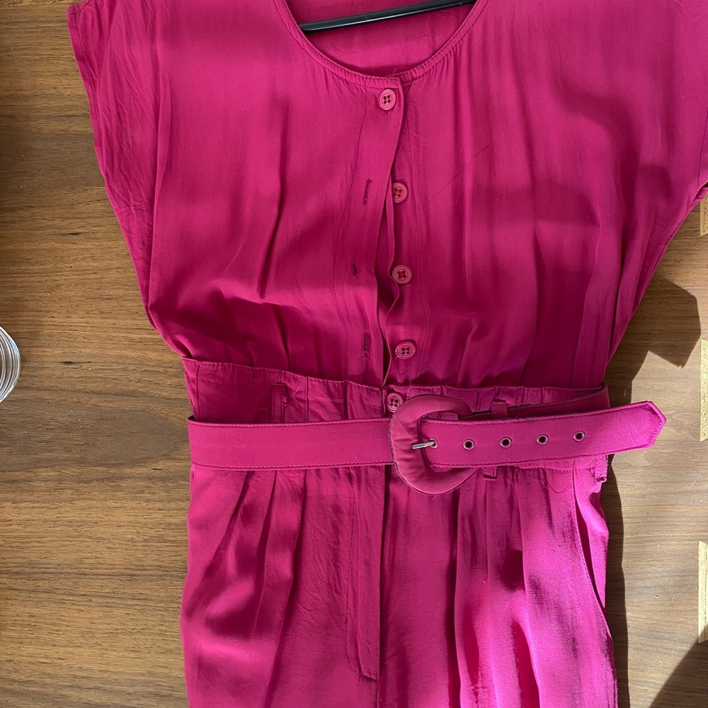 Vintage 80’s/90’s fushia jumpsuit with matching belt.